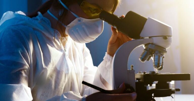 Microscopy - Photo Of Woman Looking Through Camera