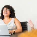 Engineering - Woman in White Dress in Front of Silver Macbook