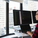 Engineering - Woman Sitting While Operating Macbook Pro