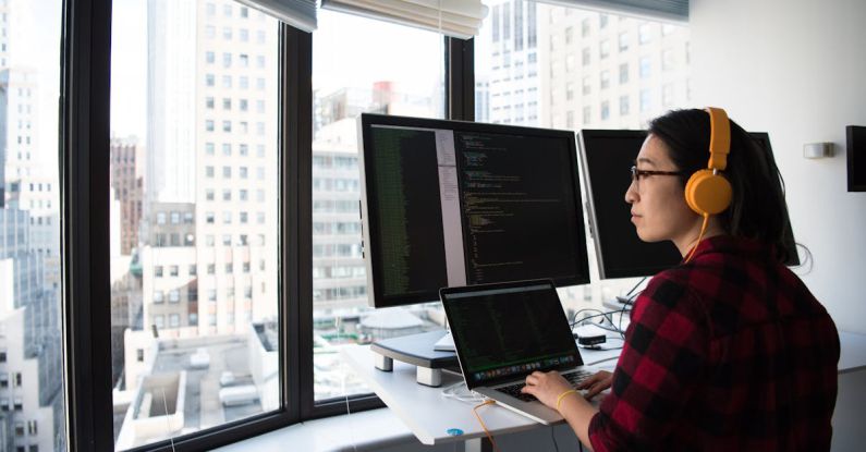 Engineering - Woman Sitting While Operating Macbook Pro