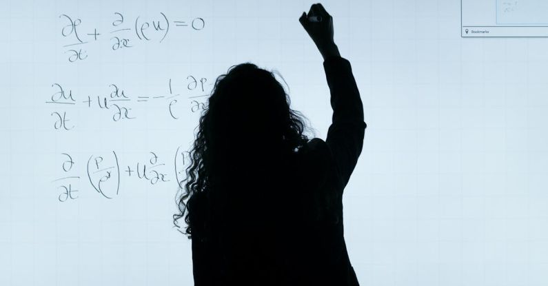 Quantum Physics - Woman Writing On A Whiteboard
