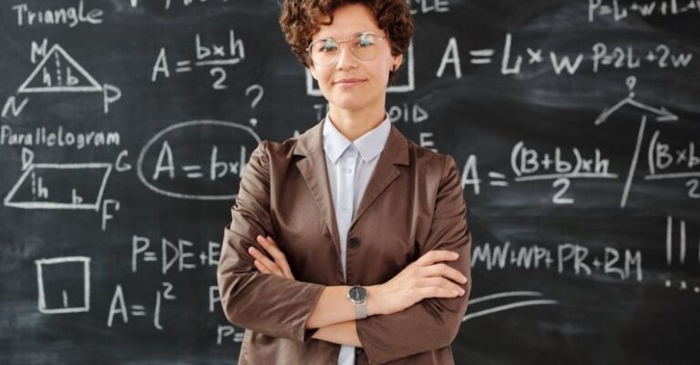 Quantum Physics - Photo Of Woman Standing In Front Of Blackboard