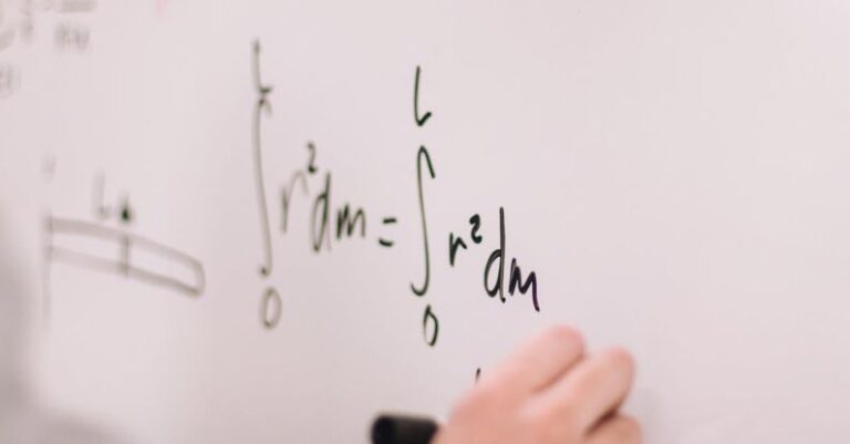 Quantum Physics - Person Writing On White Board