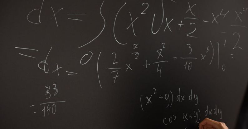 Quantum Physics - Equations Written On Blackboard