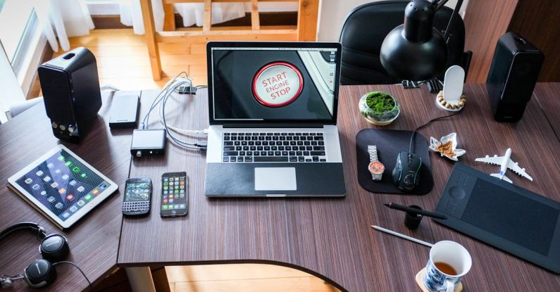 Electronics - Black and White Laptop Computer on Brown Wooden Desk