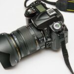 Electronics - Black Dslr Camera on White Surface