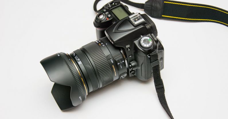 Electronics - Black Dslr Camera on White Surface